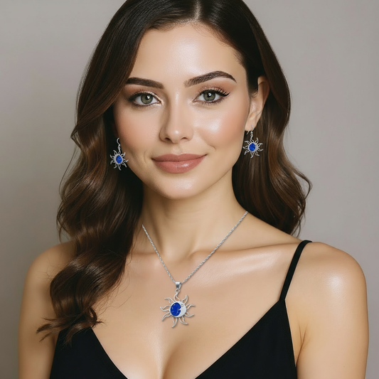 Detail of Blue Fire set showing radiant sun pendant with opal core and matching earrings