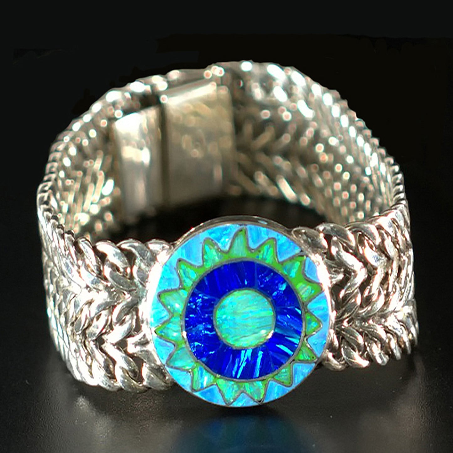 Close-up detail Emerald Sun bracelet showing interwoven sterling silver pattern and nature connection symbolism