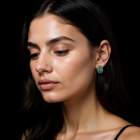 Detail of Green Essence earrings showing green cubic zirconia in channel setting