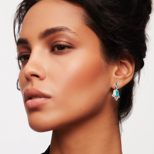 Detail of Wings of Protection earrings showing Hand of Fatima design and green tourmaline